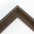 This floater frame features a deep black wood finish with a subtle natural grain for a refined, contemporary look. At 1-1/16 "es deep, it provides a bold floating effect that adds depth and sophistication to modern and minimalist artwork.